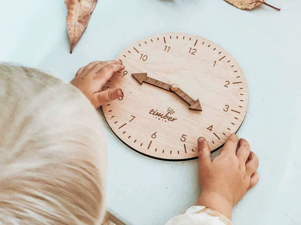 Montessori Timber Learning Clock This beautifully handmade timber learning clock will help little ones learn how to read the time. The clock & arrows are made from two different timbers to help with identifying minutes to hours.