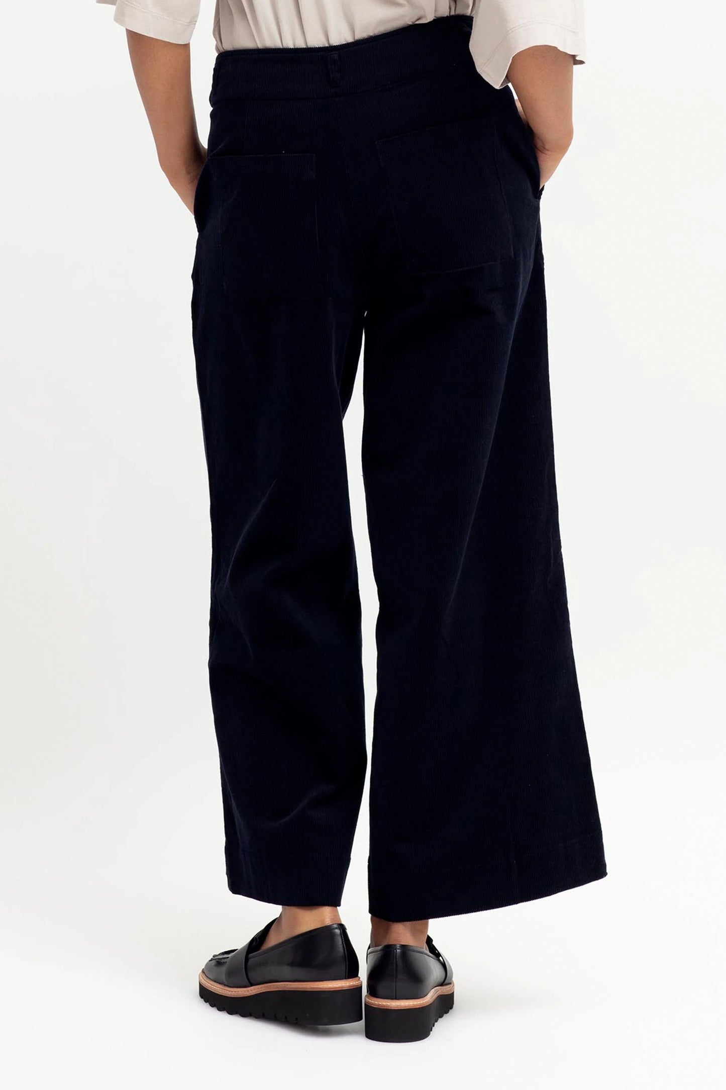 
                  
                    Koord Pant Crafted from an organic cotton fine cord, the Koord Pant is a wide leg pant with a hem turn up, hitting at or just below the ankle bone. Secured at the waist with a flat waistband with belt loops, and a front zip fly plus a hook and bar closure, this pant features angled front side pockets and back patch pockets. There are darts at the back of the pant for an improved fit.
                  
                
