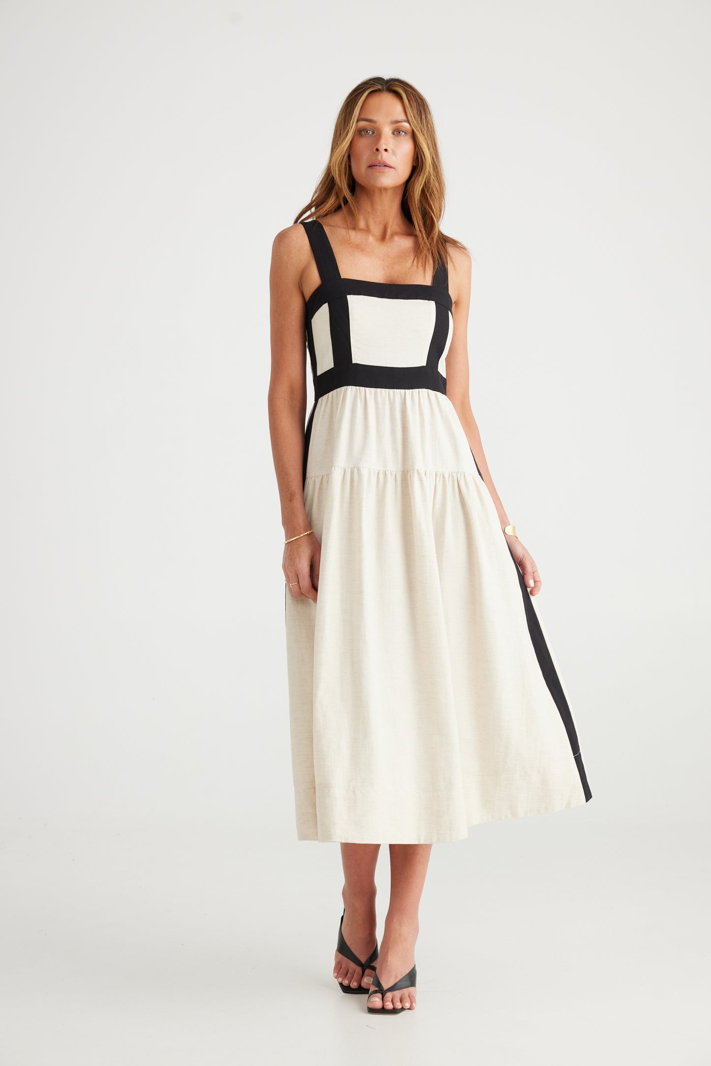 
                  
                    Jolie Dress | Natural + Black Featured contrast panels Full skirt gathered into waistband Side seam pockets Centre back zip openeing Midi length 50% Cotton, 30% Linen, 20% Lyocell
                  
                