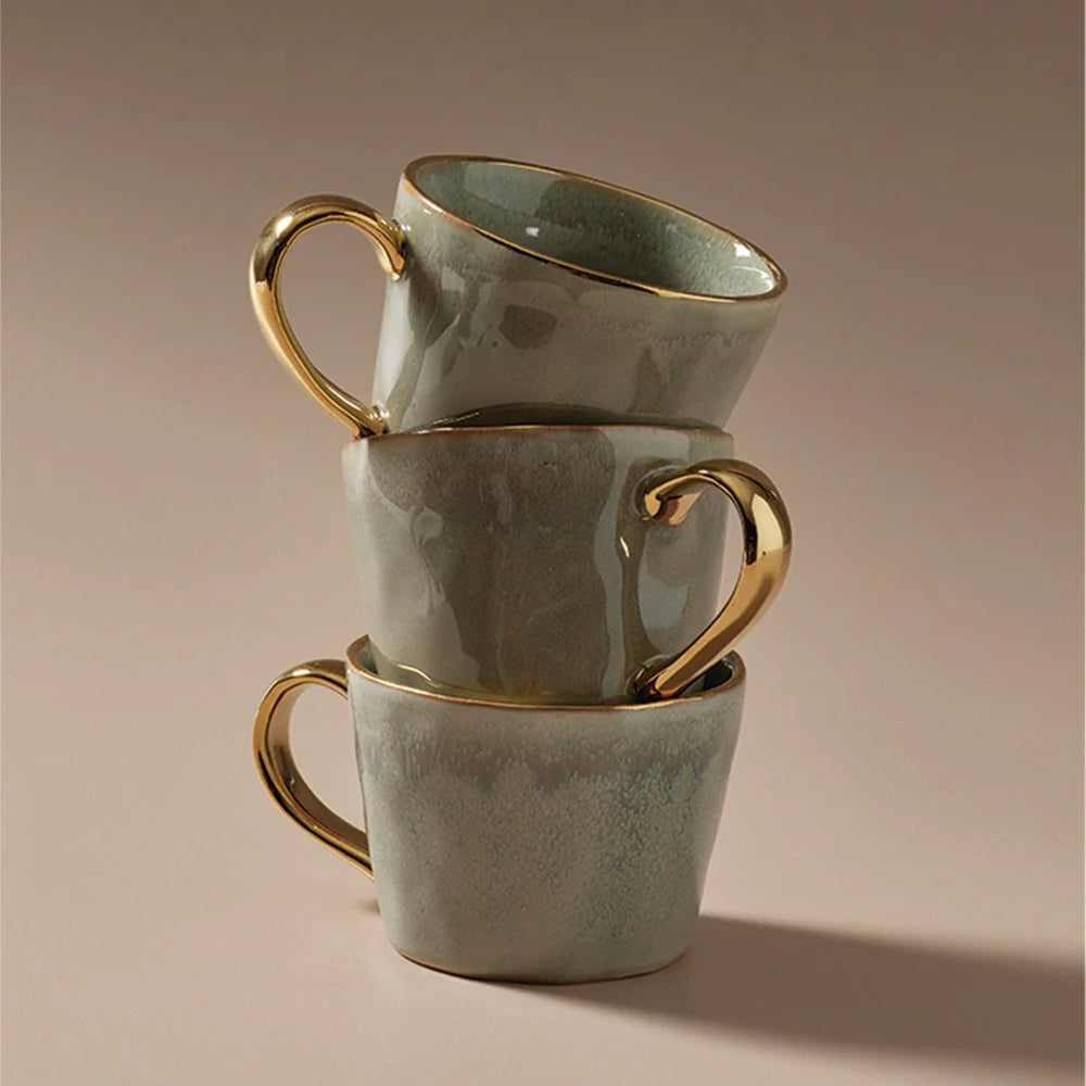 Ariel Mug | Seamist The stunning Ariel Mugs are handmade and glazed with a feature gold on the rim and handle. Available in 6 colours, they're a great gift - or the perfect addition to yor mug collection!