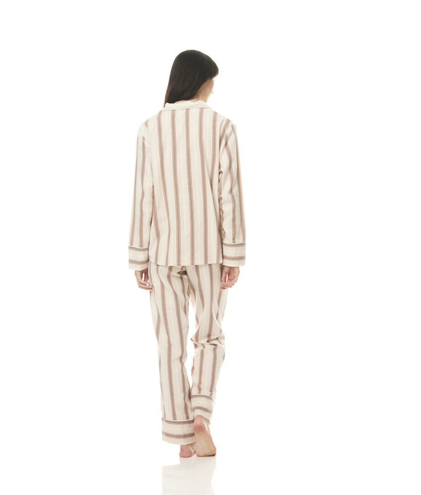 
                  
                    Ilana Cotton Pyjamas | Tan Stripe | The Iliana style pyjamas are crafted from high-quality brushed cotton, making them incredibly soft and warm against your skin.
                  
                