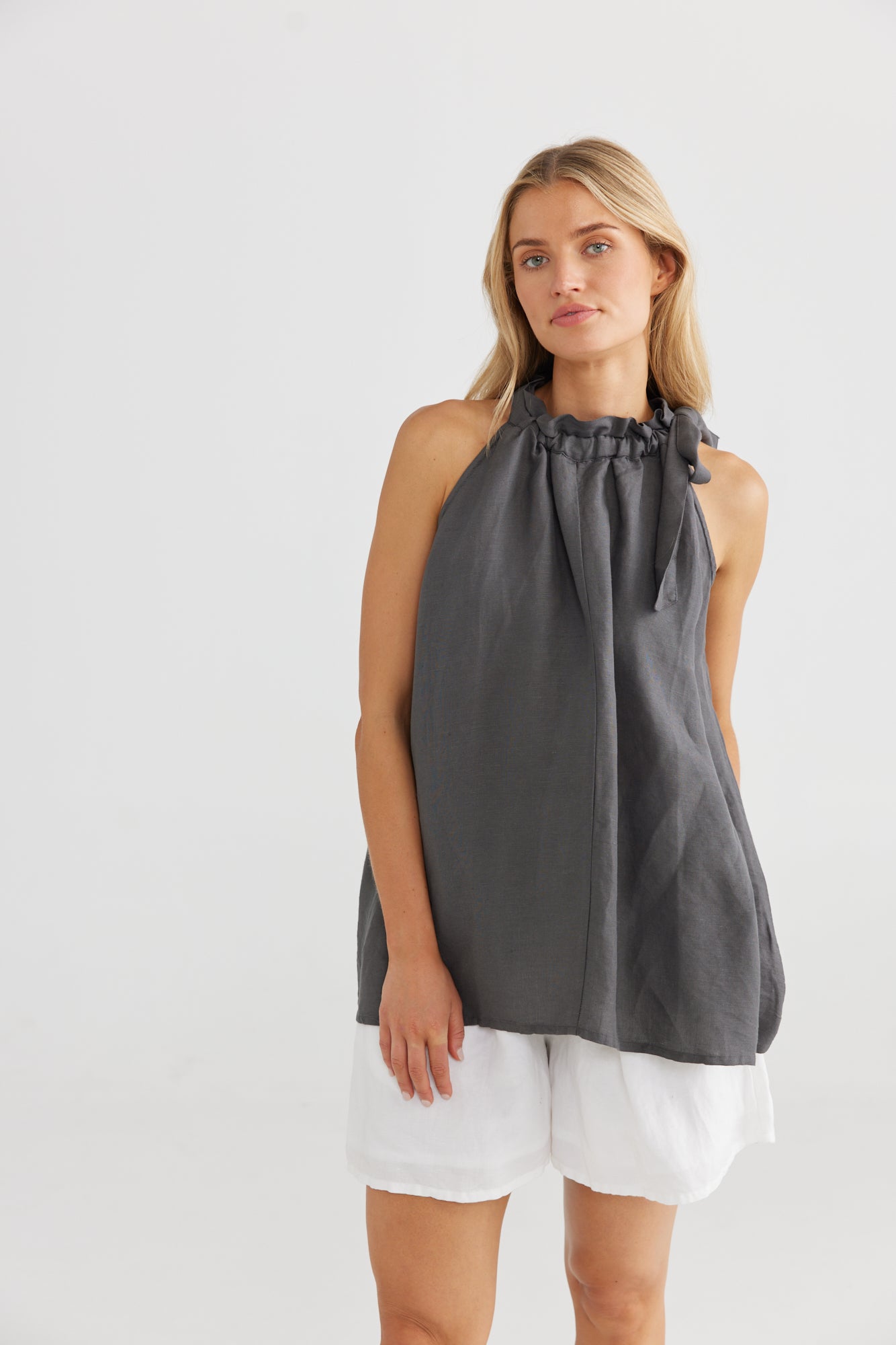 
                  
                    Lucia Top Floaty, relaxed fit Halter neck Paper bag drawstring neckline Charcoal - 55% Linen, 45% Viscose White - 100% Linen, lining 100% cotton
                  
                