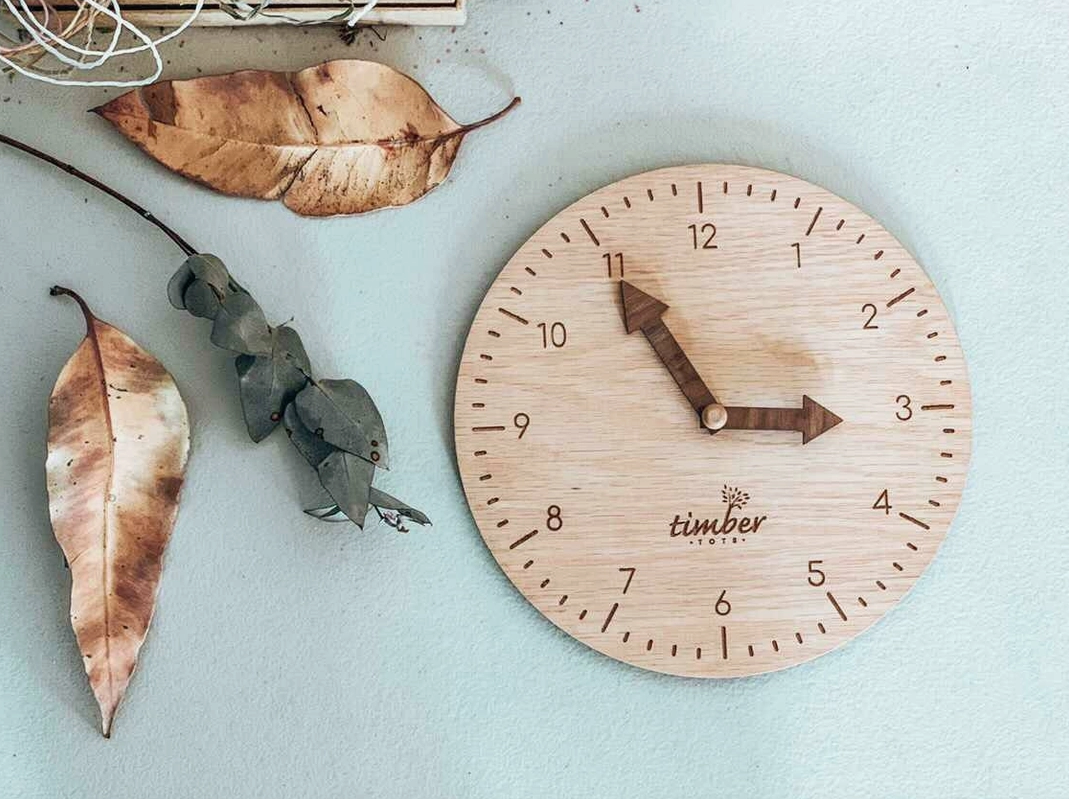 
                  
                    Montessori Timber Learning Clock This beautifully handmade timber learning clock will help little ones learn how to read the time. The clock & arrows are made from two different timbers to help with identifying minutes to hours.
                  
                