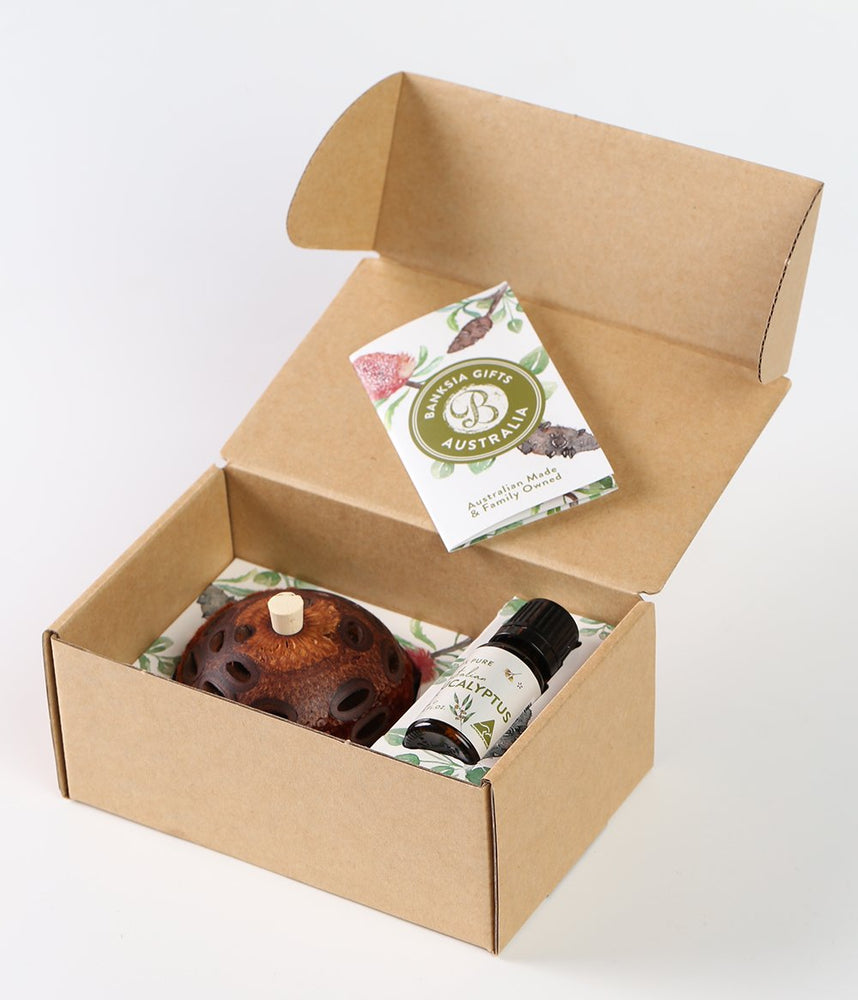 Banksia Eucalyptus Gift Box Containing a Mini Banksia Aroma Pod and a bottle of our Eucalyptus Oil.  The box displays information on the Banksia seed pod and instructions on how to use the Aroma Pod.