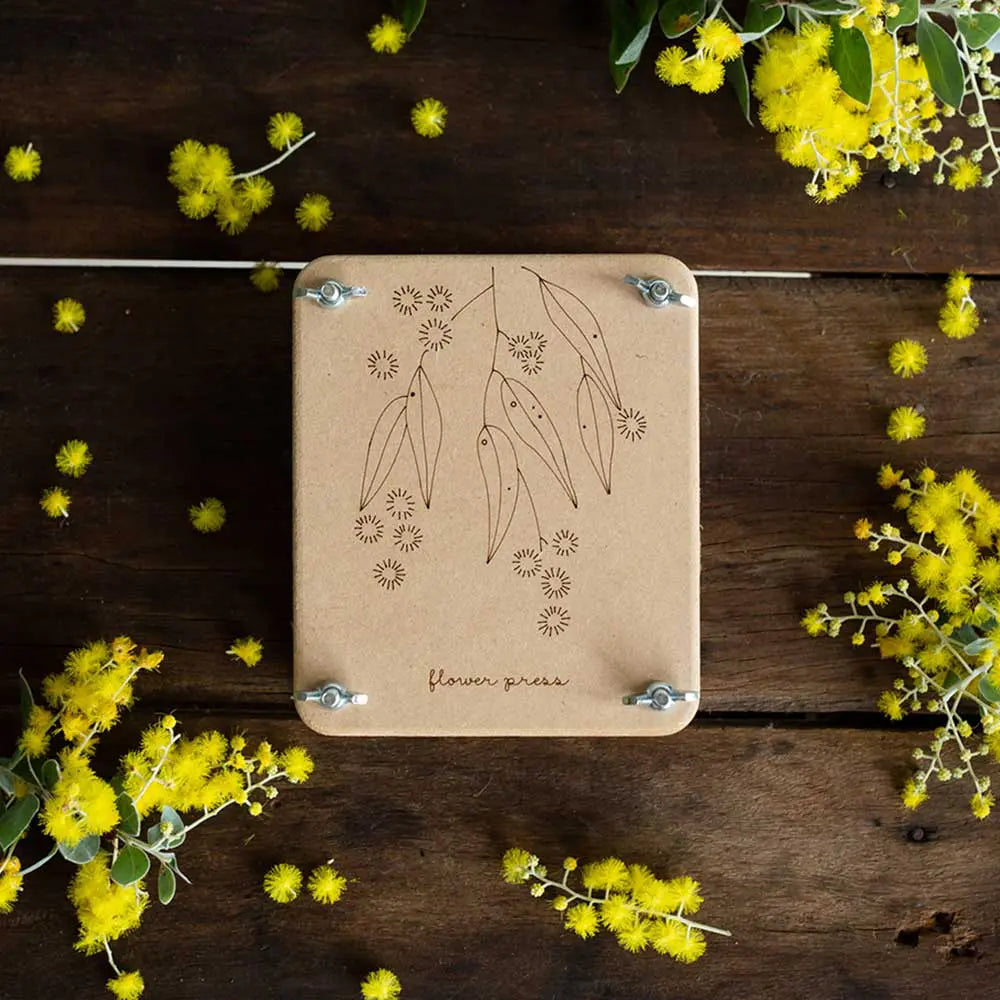 Mini 'Wattle' Flower Press Introducing the new Mini Flower Press, featuring a gorgeous illustration of Australian native Golden Wattle.   Eternalise the beauty of your flowers and foliage with this beautifully designed gift.